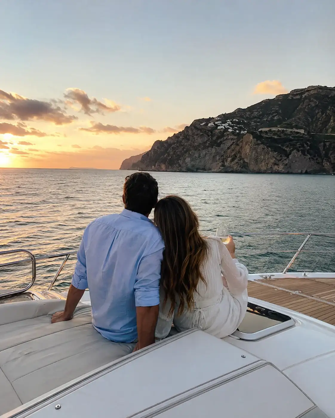 Couple sitting at the bow of a boat