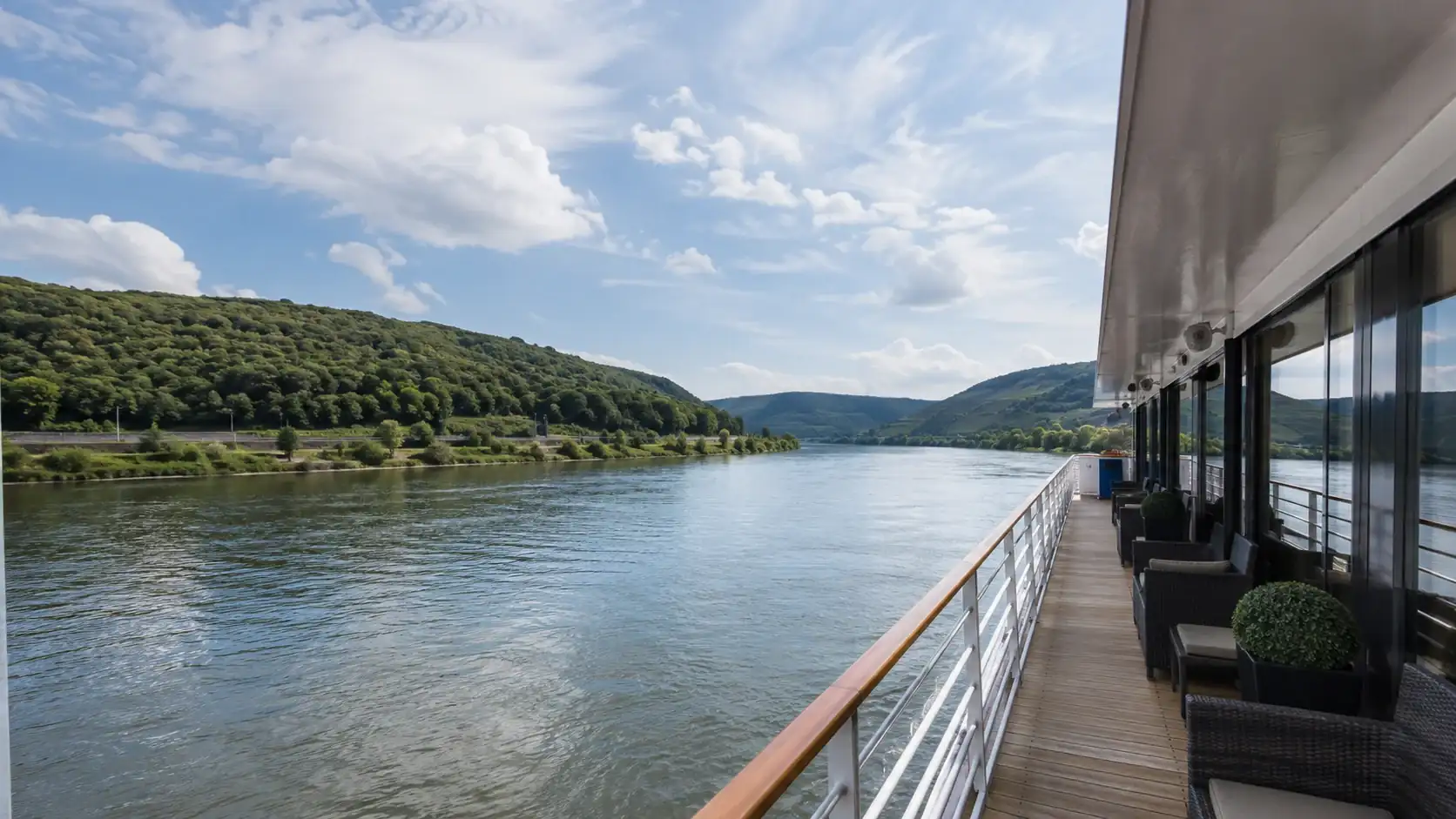 View from a passenger vessel over green shoreline