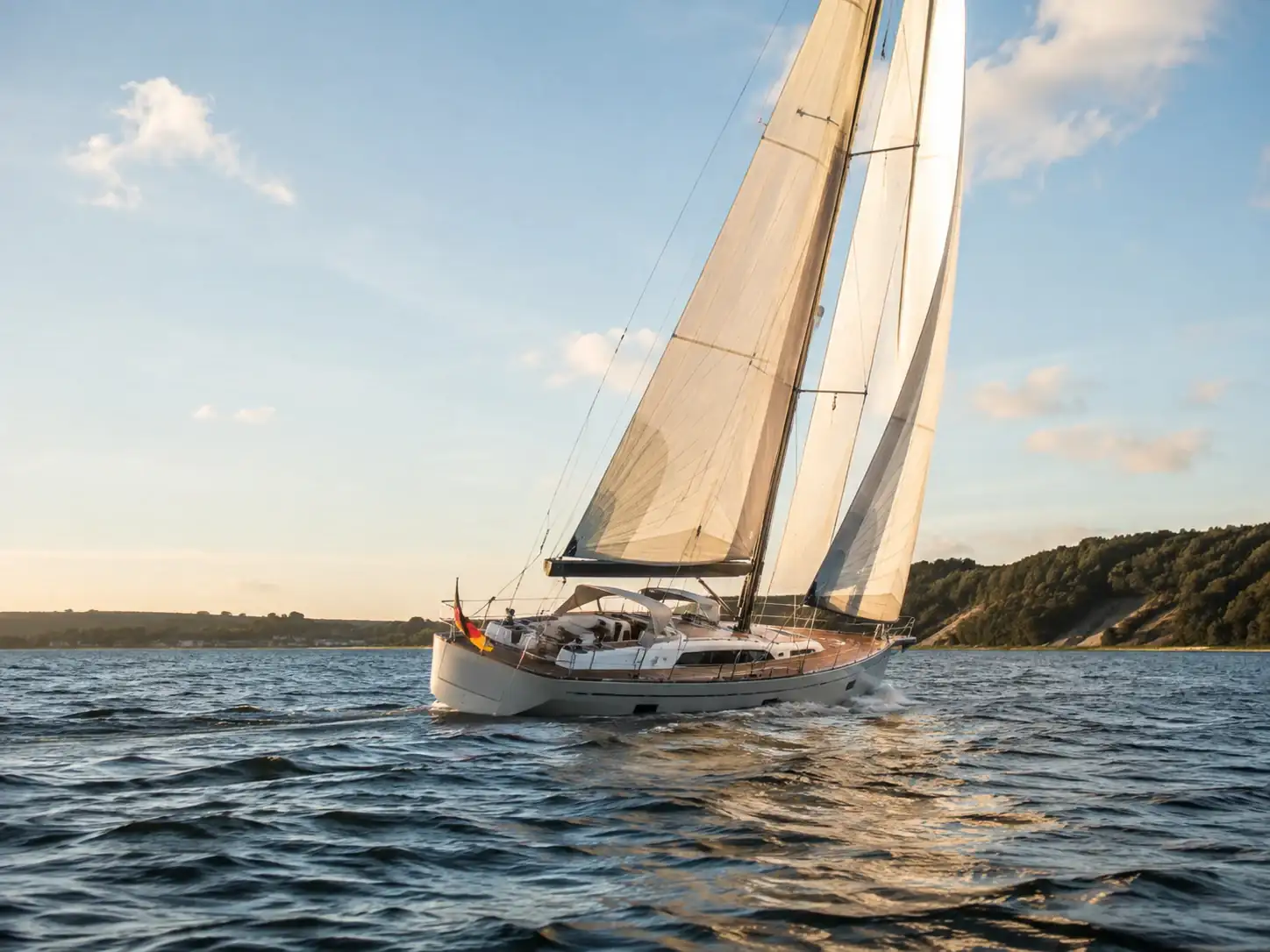Sailing yacht under way in evening light